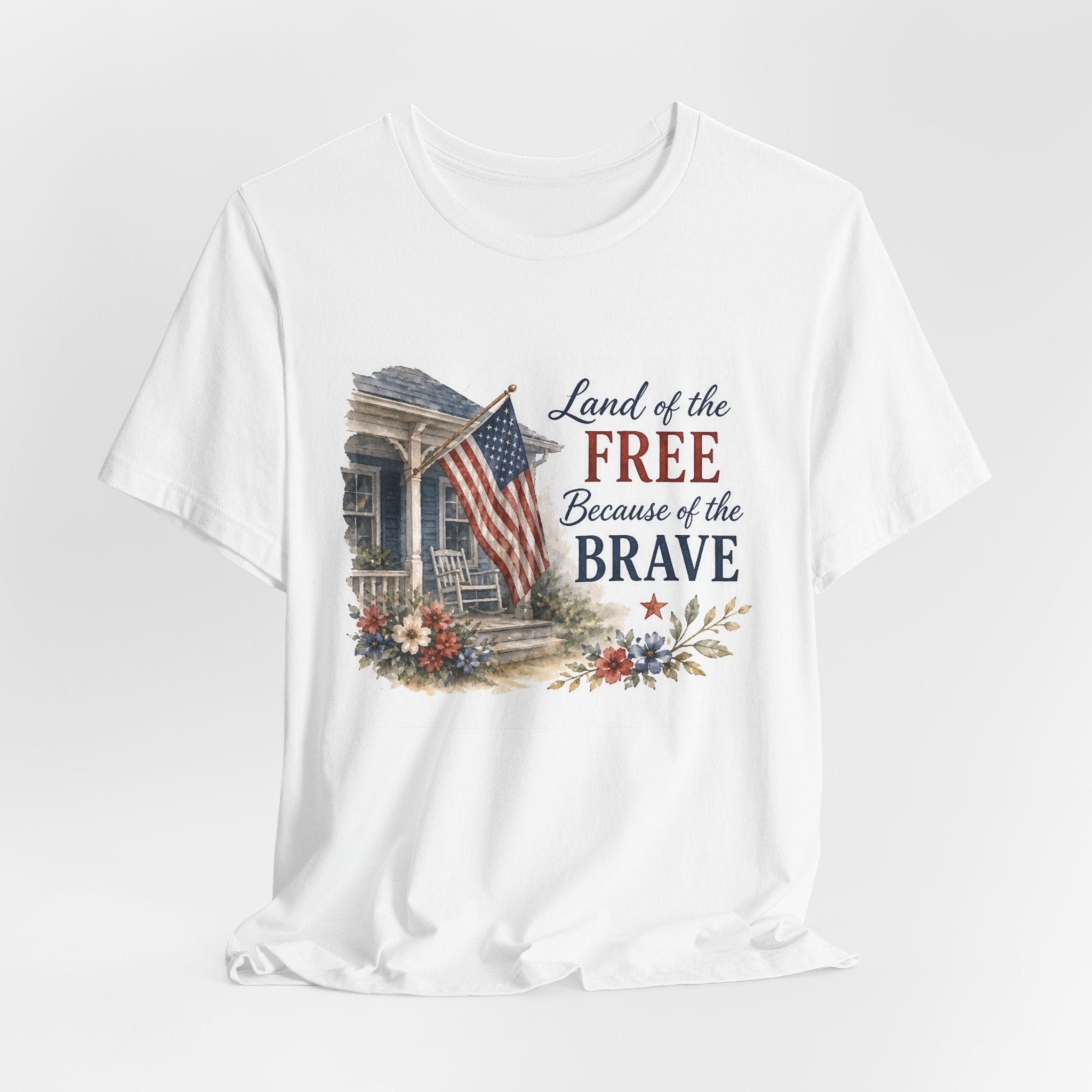 White t-shirt with "Land of the Free Because of the Brave" watercolor design.