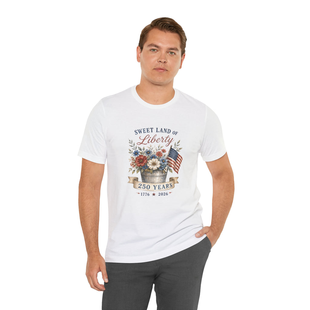 White t-shirt with "Sweet Land of Liberty 250 Years" and patriotic flowers.